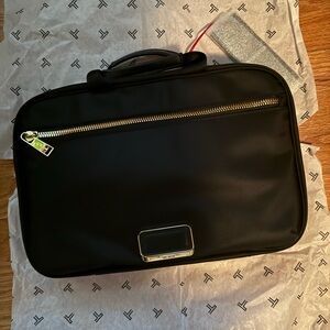 Tumi Black Cosmetic Bag with Gold Accents